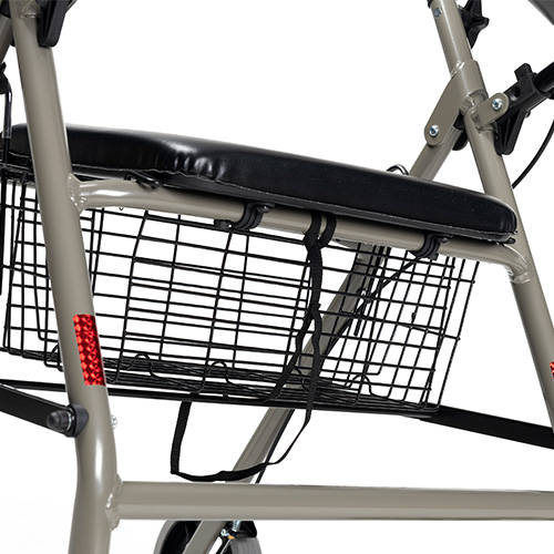 Rollator Eco-Light, Nahaufnahme der gepolsterten Sitzflaeche ueber dem Drahtkorb mit Reflektor