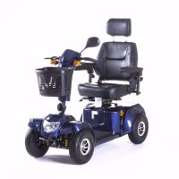 Vierrädriger Elektroscooter Bility S in Blau mit gepolstertem Sitz, Kopfstütze, Korb und Beleuchtung